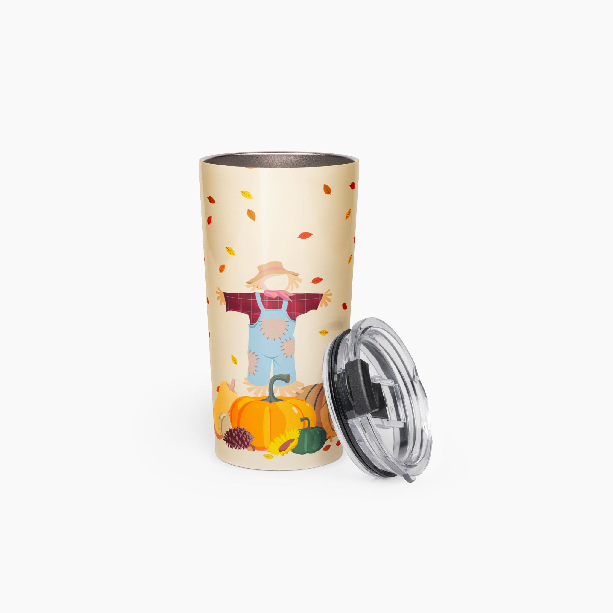 A tall insulated travel tumbler with a cream-colored background and a colorful autumn-themed illustration featuring a scarecrow, pumpkins, and falling leaves. The tumbler is shown with a clear plastic lid on a clean light grey background.
