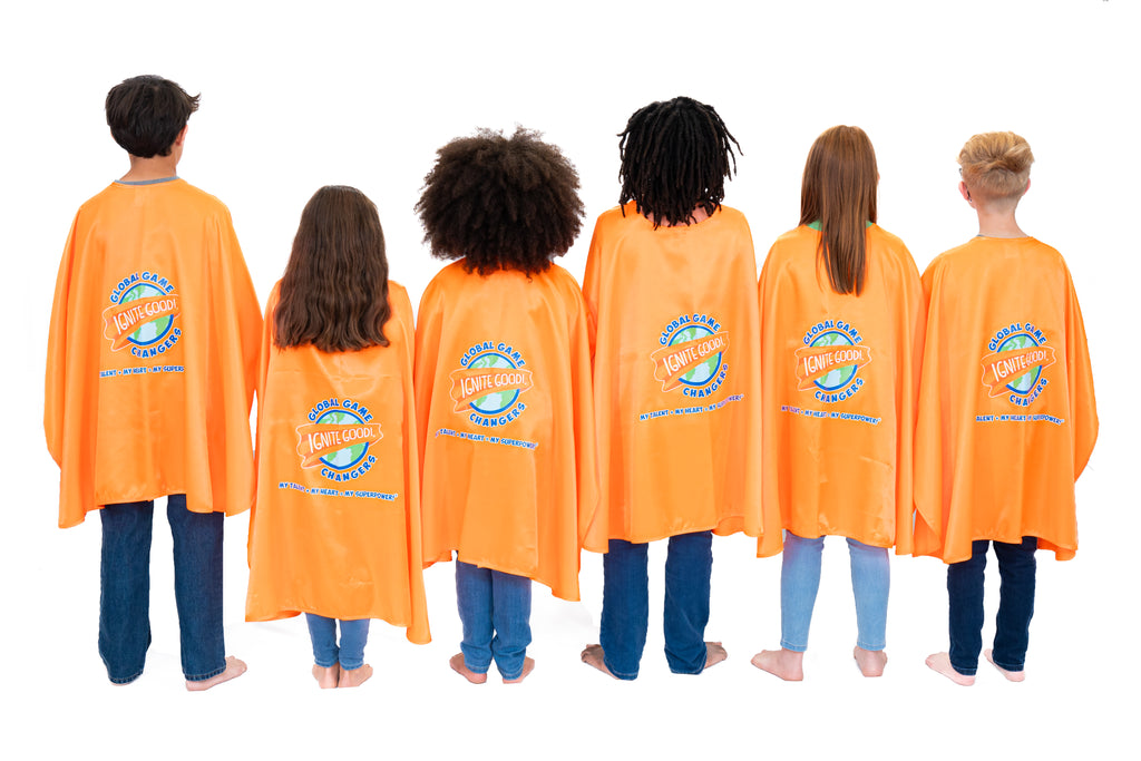 Children wearing orange superhero capes with Global Game Changers logo on a white background