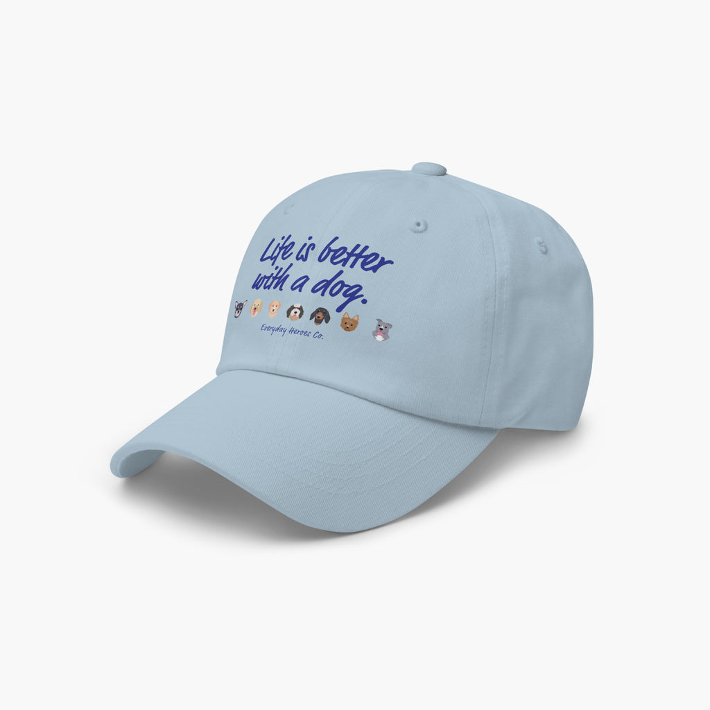Light blue cap with 'Life is better with a dog' text and dog icons on a white background