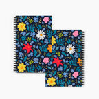 Front and Back covers of spiral notebooks with blue floral patterns on a white background