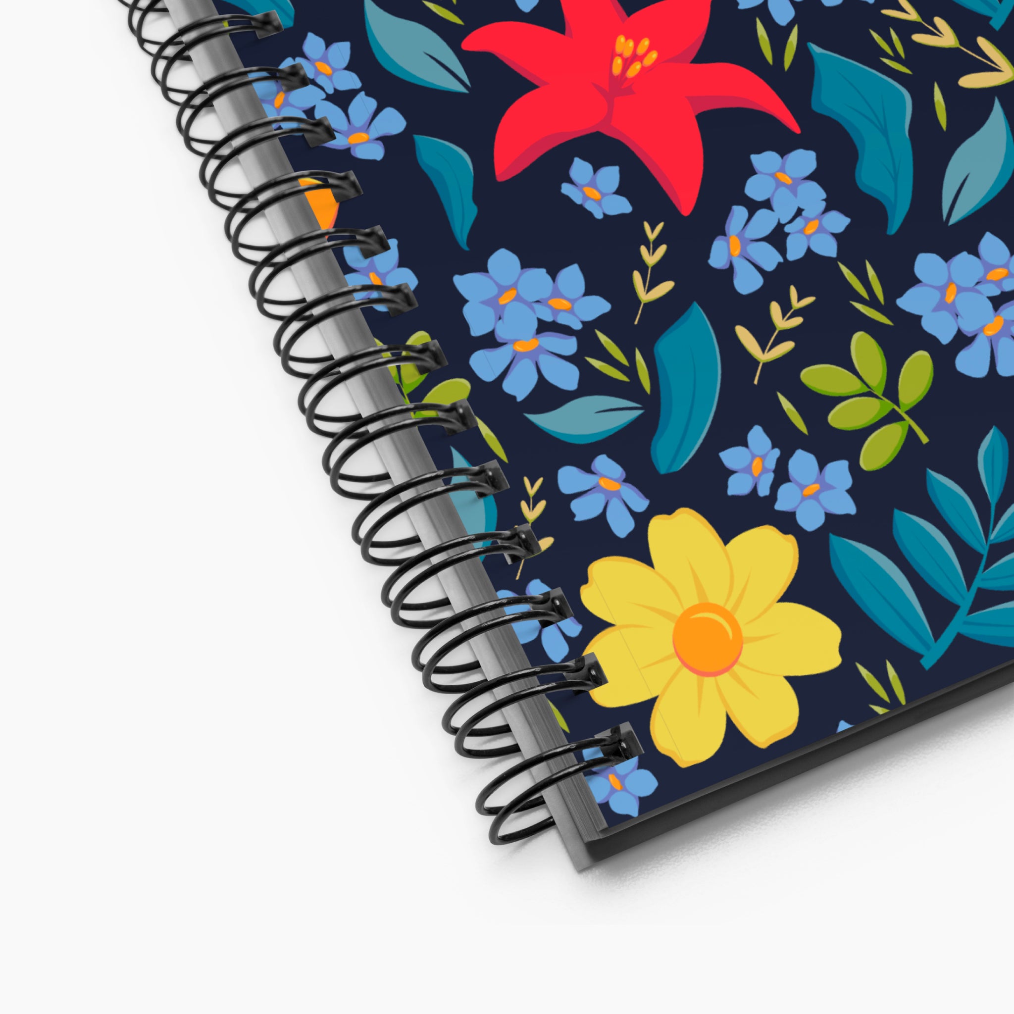 Spiral Notebook exterior closeup with blue floral pattern on a white background