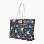 Blue Floral-patterned tote bag with colorful flowers on a white background
