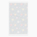 White back of Cloth kitchen hand towel with blue floral pattern on a white background