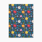 Hardcover journal with blue floral patterned front cover design on a white background
