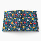 Hardcover journal with blue floral patterned cover design on a white background