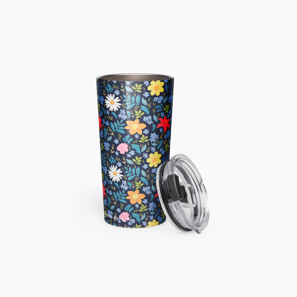 Tumbler with blue floral pattern on a white background