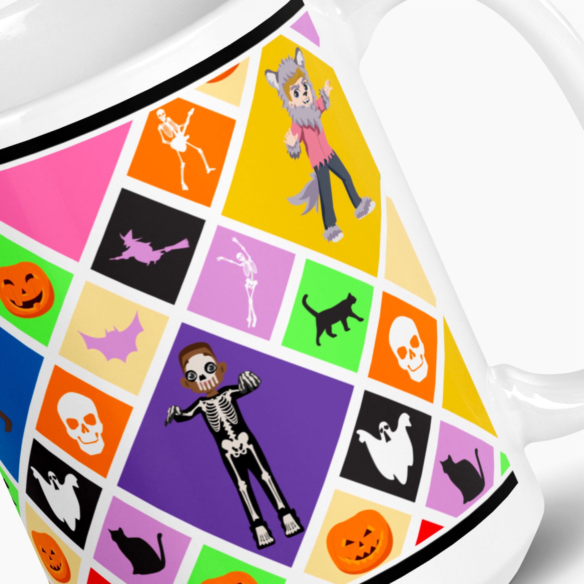 A close-up of a white ceramic mug featuring a colorful Halloween-themed grid pattern with cartoon skeletons, jack-o'-lanterns, bats, ghosts, and black cats, with cartoon kids in costumes on bright colored squares.