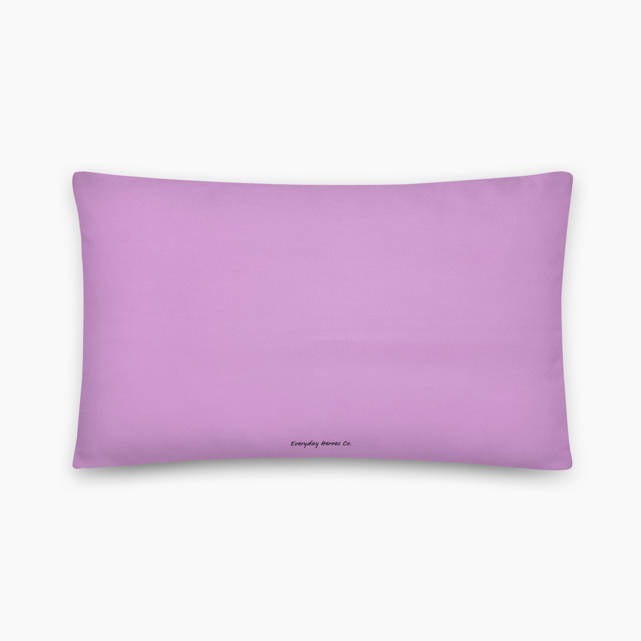 The back of a rectangular lavender colored throw pillow with a small black printed logo at the bottom center, displayed on a clean light grey background.
