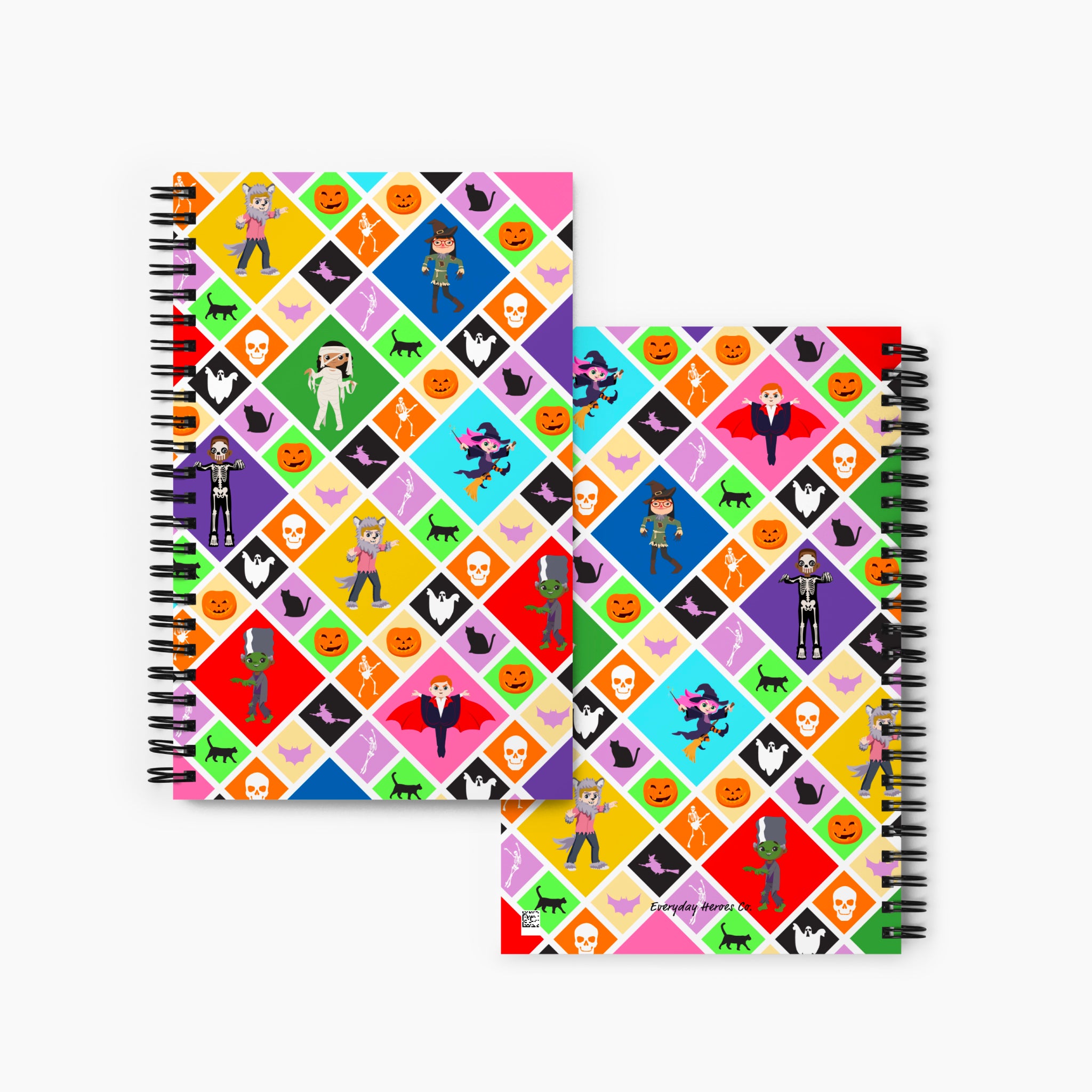 A front and back cover of a spiral-bound notebook featuring a Halloween-themed diamond pattern with pumpkins, ghosts, bats, a skeleton, and cartoon kids in costumes, shown on a light gray background.