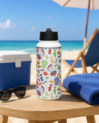 Colorful water bottle with dad-themed design on a table by the ocean.