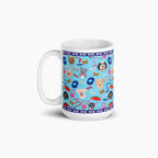 White mug with light blue dog-themed design on a white background