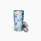 Tumbler with a dog-themed pattern on a light blue background