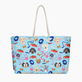 Tote bag with dog-themed pattern on a light blue background