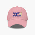 Pink cap with 'Dog's Person' text and dog illustration on a white background