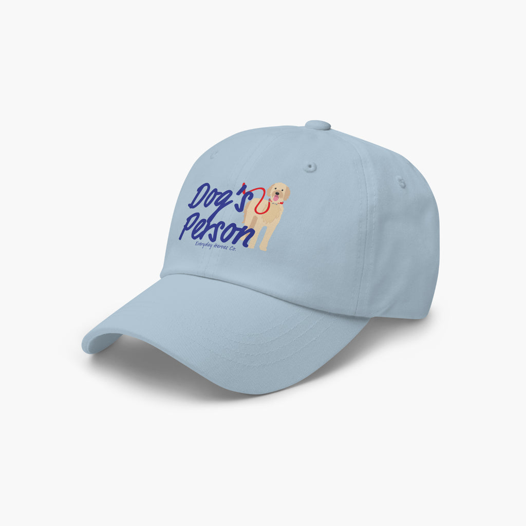 Light blue cap with 'Dog's Person' text and dog illustration on a white background