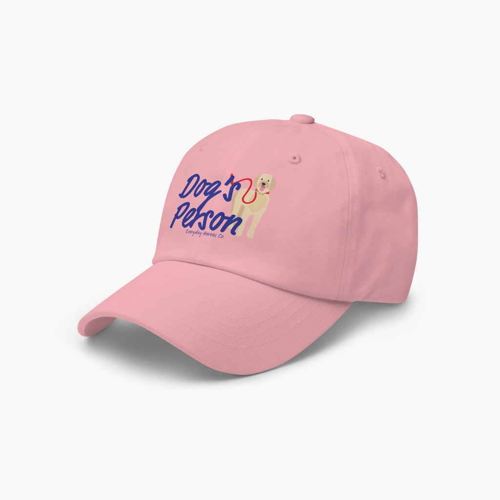 Pink cap with 'Dog's Person' text and dog illustration on a white background