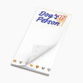 Notepad with 'Dog's Petson' text and dog illustrations on a white background