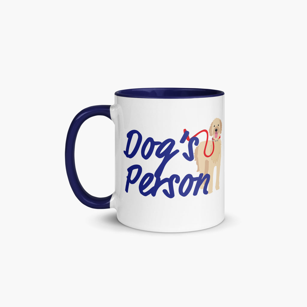 Mug with navy handle and interior featuring 'Dog's Person' text and a dog illustration on a white background