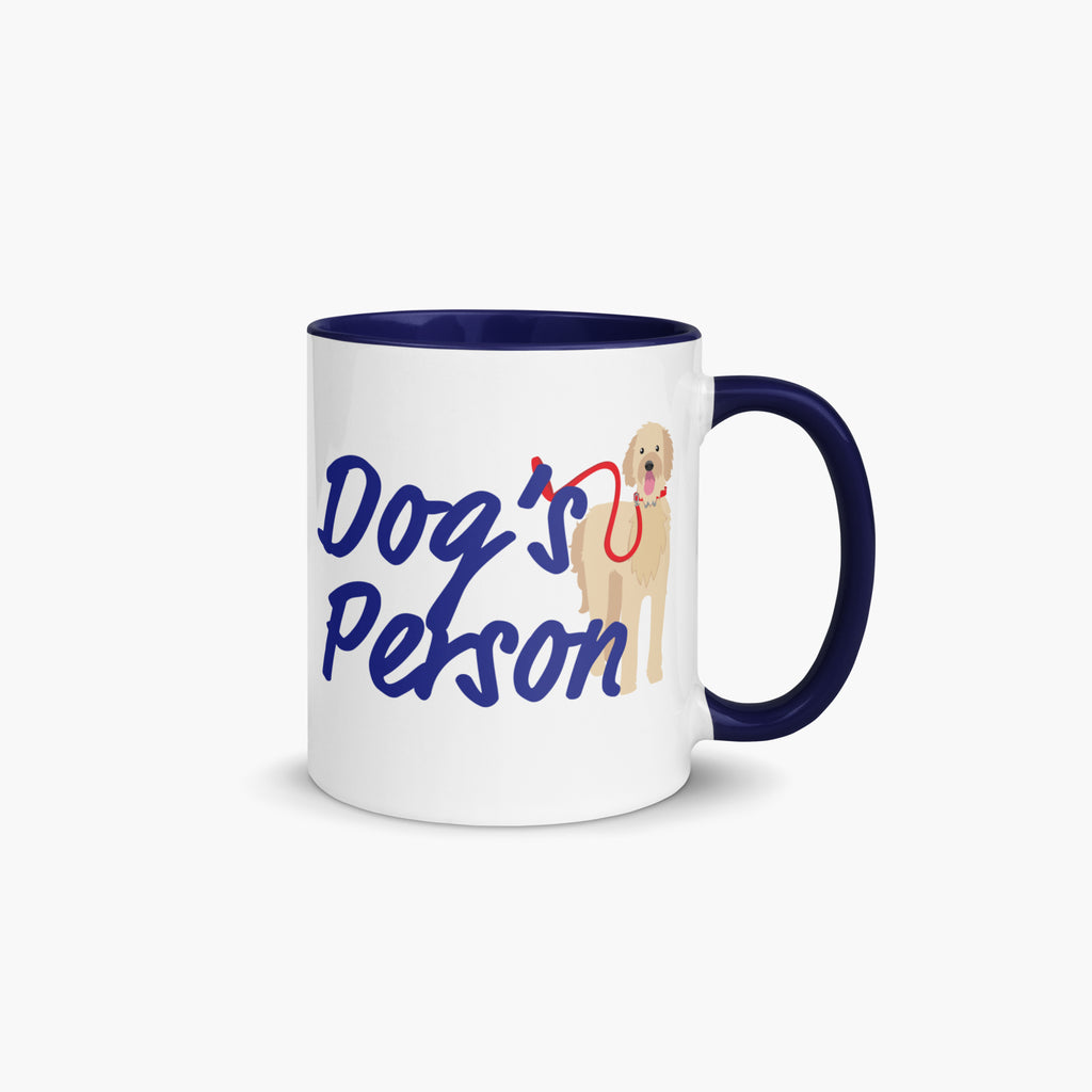 Mug with navy handle and interior with 'Dog's Person' text and dog illustration on a white background