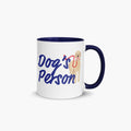 Mug with navy handle and interior with 'Dog's Person' text and dog illustration on a white background