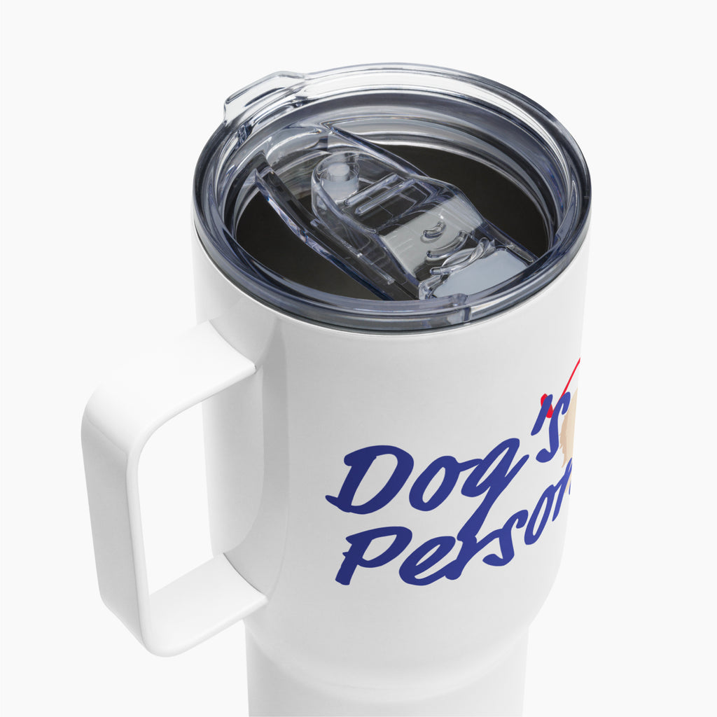 White travel mug with blue text 'Dog is Person' on a white background