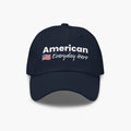 Navy blue cap with 'American Everyday Hero' text and flag on a white background