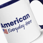 Close-up of a White mug with blue interior and handle, featuring 'American Everyday Hero' text and American flag.