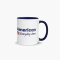 Mug with navy interior featuring 'American Everyday Hero' text and American flag on a white background