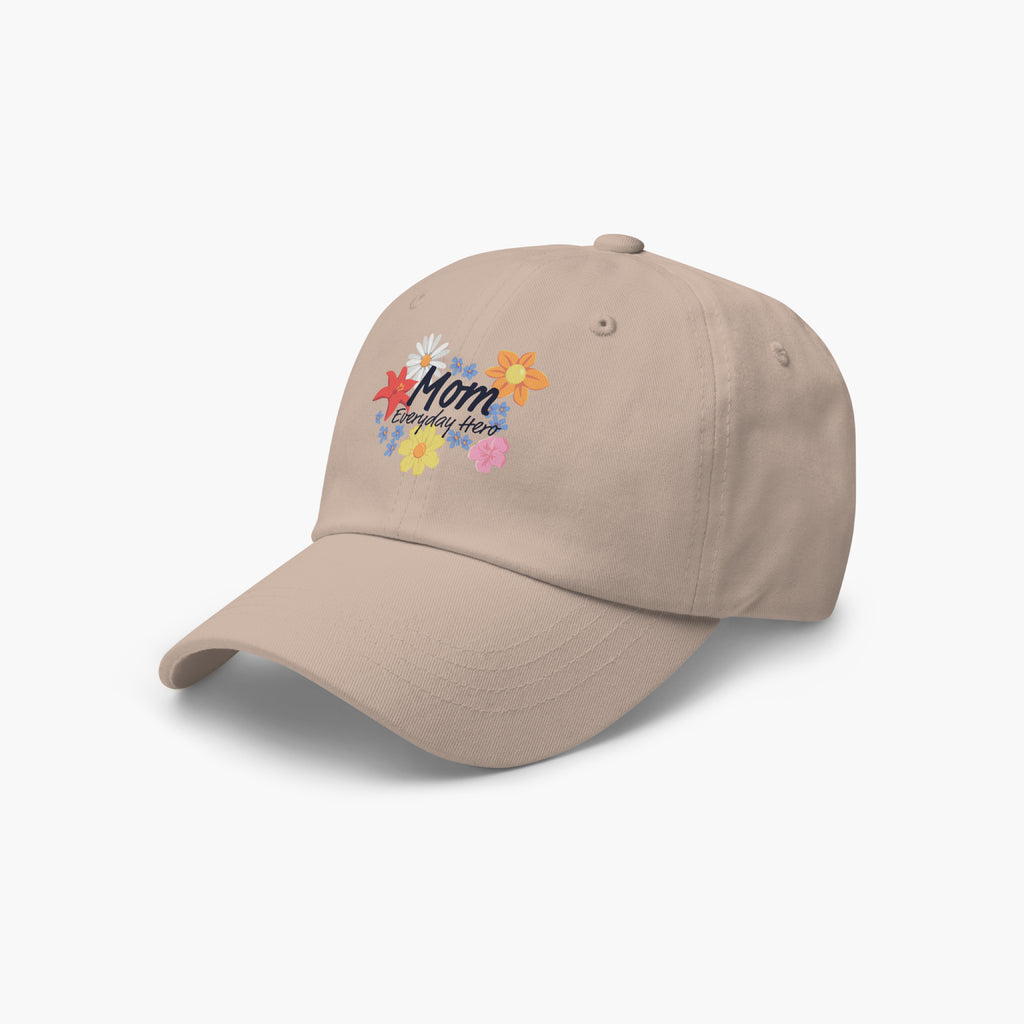 Sand colored cap with colorful text 'Mom Everyday Hero' and floral printed design on a white background
