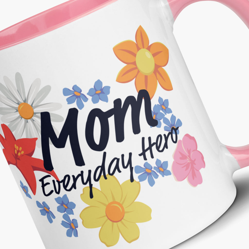 Mug with pink handle and interior featuring 'Mom Everyday Hero' text and colorful flowers on a white background