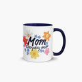 Mug with navy handle and interior featuring 'Mom Everyday Hero' text and colorful flowers on a white background