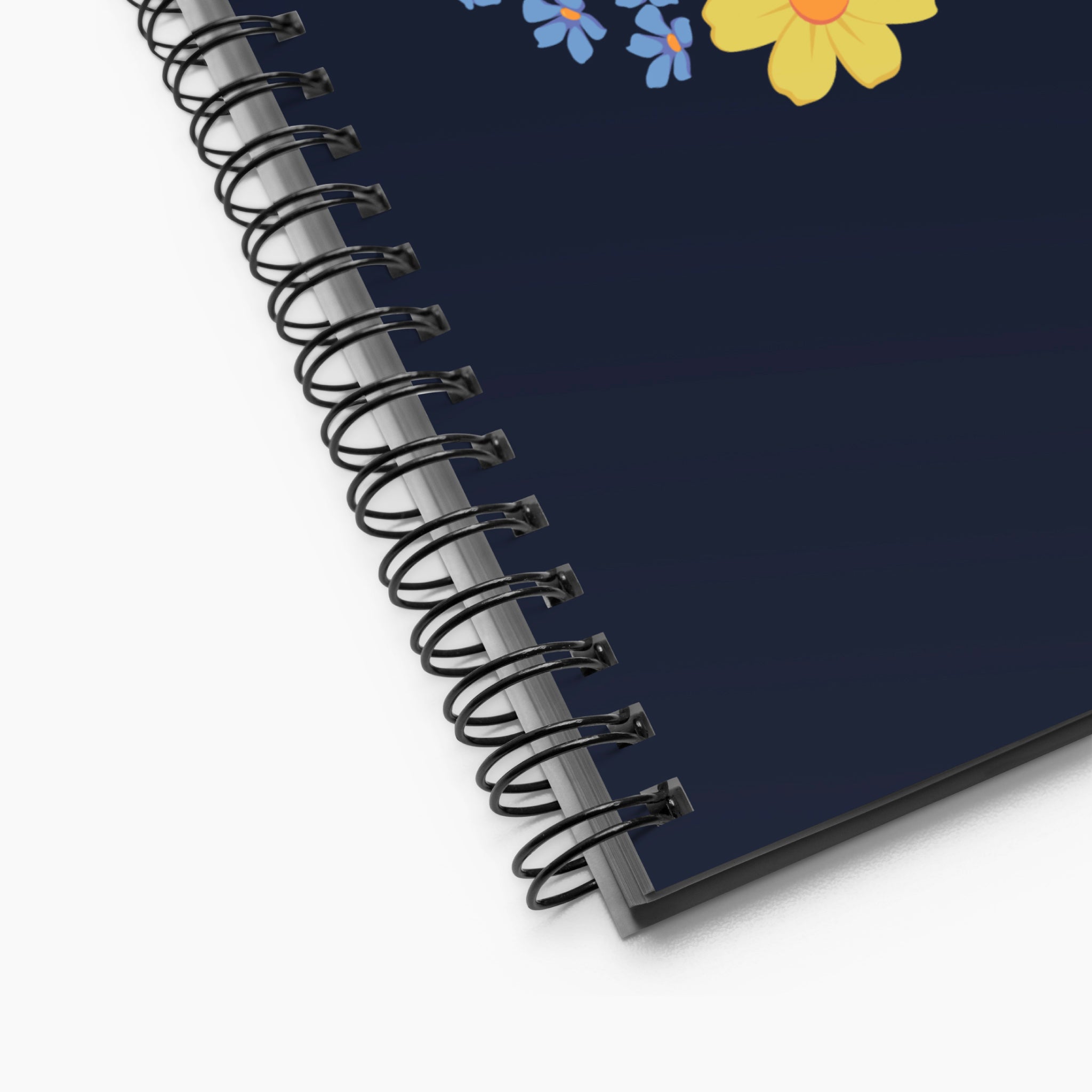 Spiral notebook with floral design on a white background