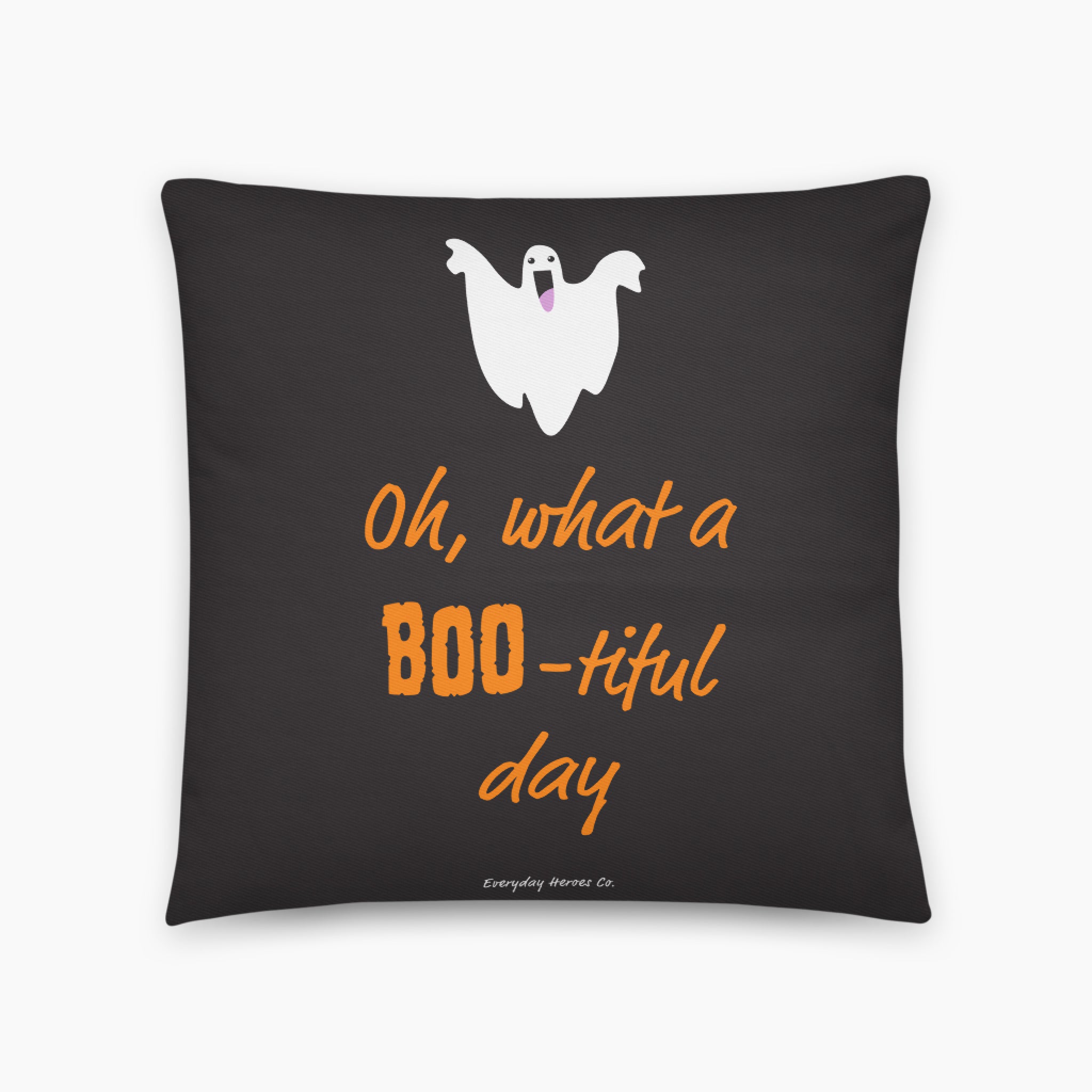 A square black throw pillow featuring a white cartoon ghost and orange text that reads 'Oh, what a BOO-tiful day' on a light gray background.