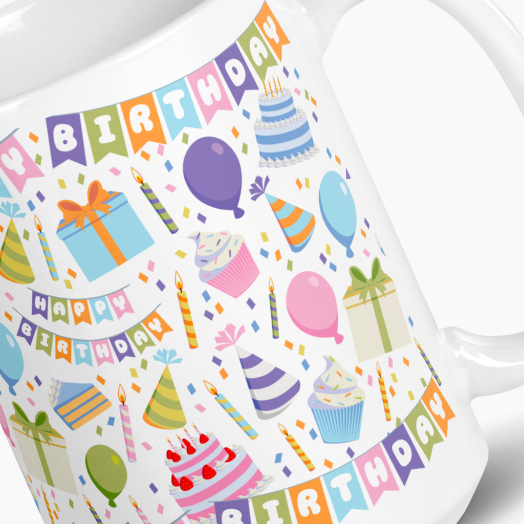 White mug with colorful birthday-themed design on a white background