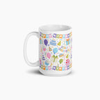 White mug with colorful birthday-themed design on a white background