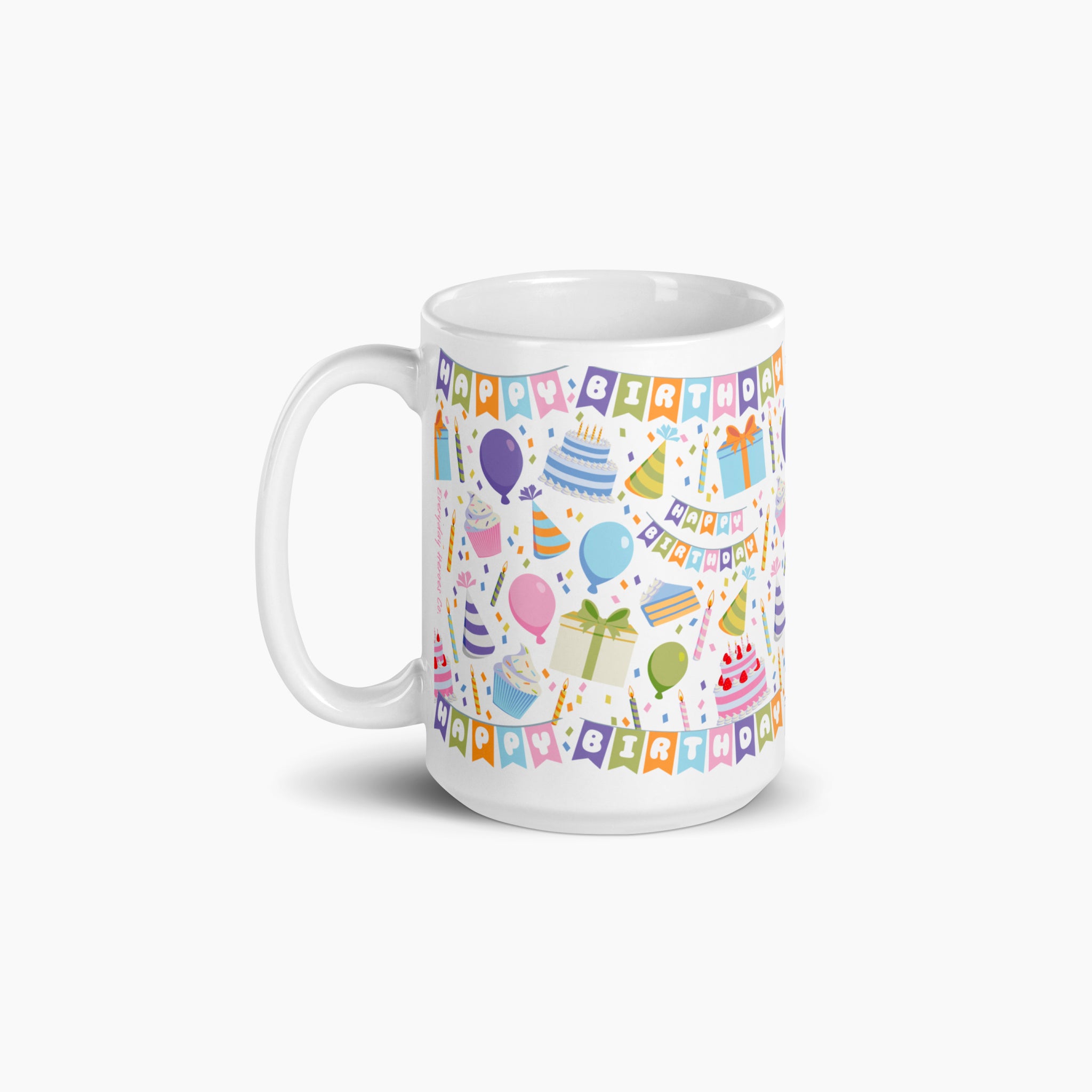 White mug with colorful birthday-themed design on a white background