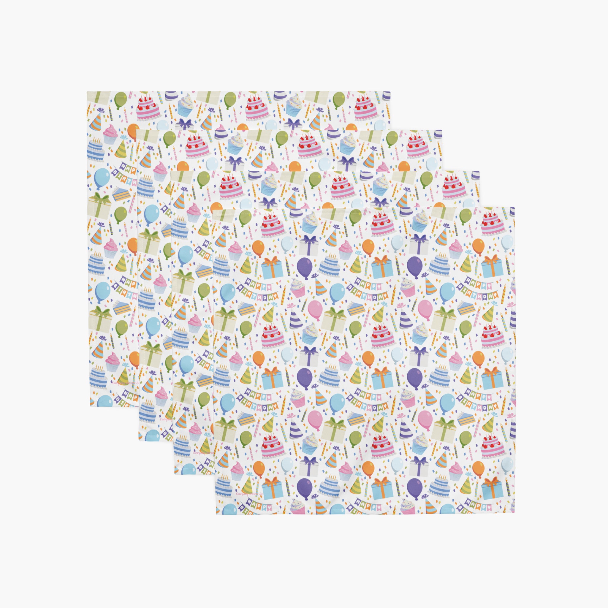 Four cloth napkins with a colorful pattern of birthday-themed illustrations on a white background.