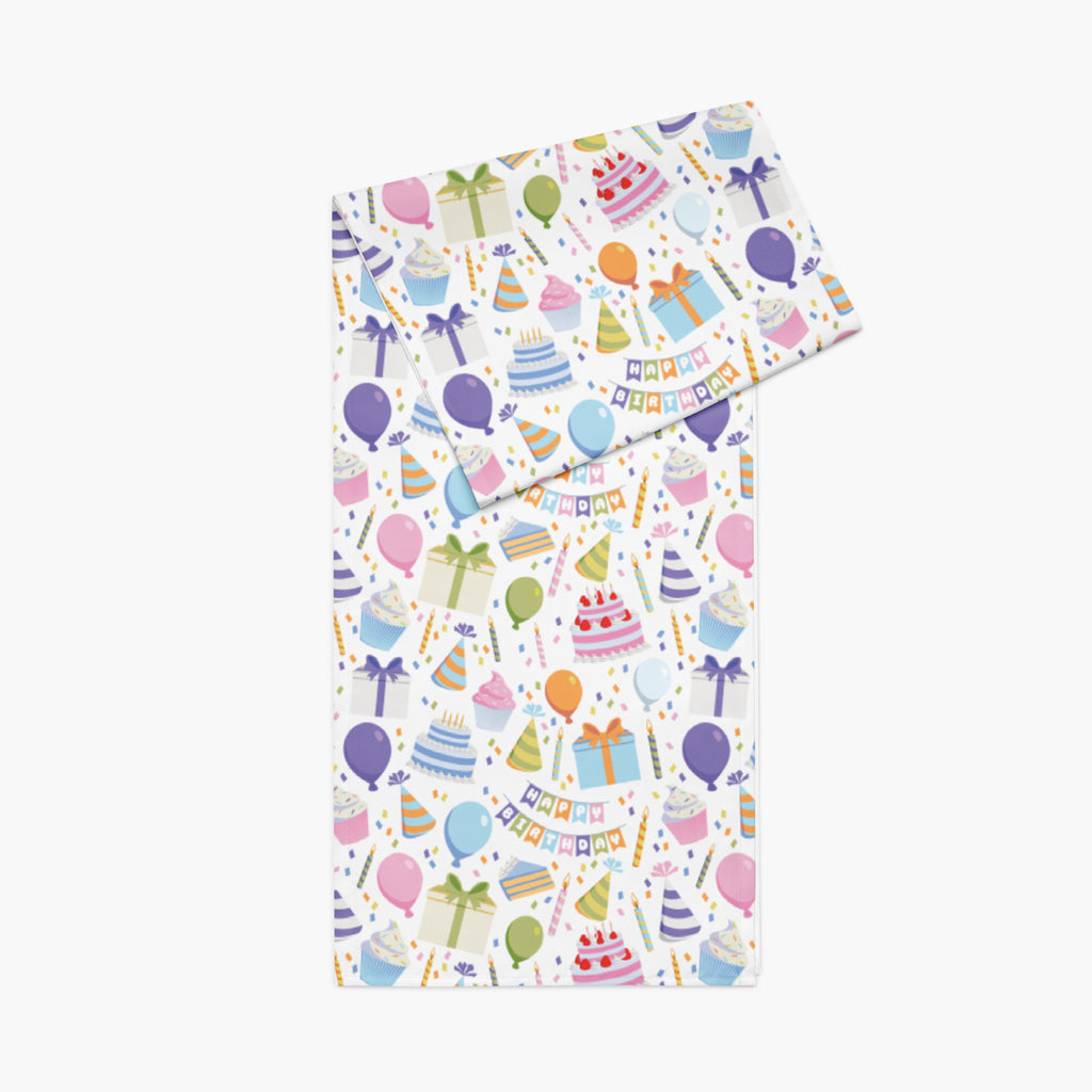 Table runner with a colorful birthday-themed pattern on a white background