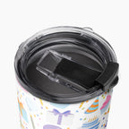 Tumbler with a colorful birthday-themed pattern on a white background
