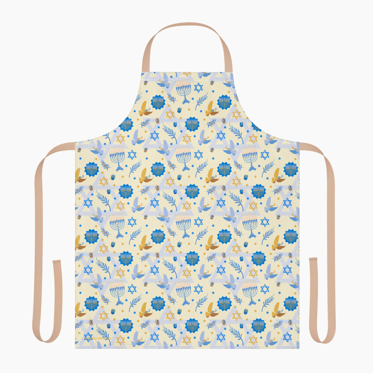 A light beige apron with a colorful repeating pattern of blue menorahs, Star of David symbols, dreidels, doves, and olive branches, shown against a plain light grey studio backdrop.