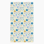A rectangular microfiber fabric hand towel with a repeating festive pattern featuring blue menorahs, blue Star of David motifs, blue circular medallions, gold stars, and small gold and blue doves on a pale cream background.