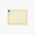 A rectangular cream-colored fabric placemat with a decorative border. The border features a repeating gold Star of David pattern around the edges, and a blue medallion with a gold menorah design in the top-left corner.