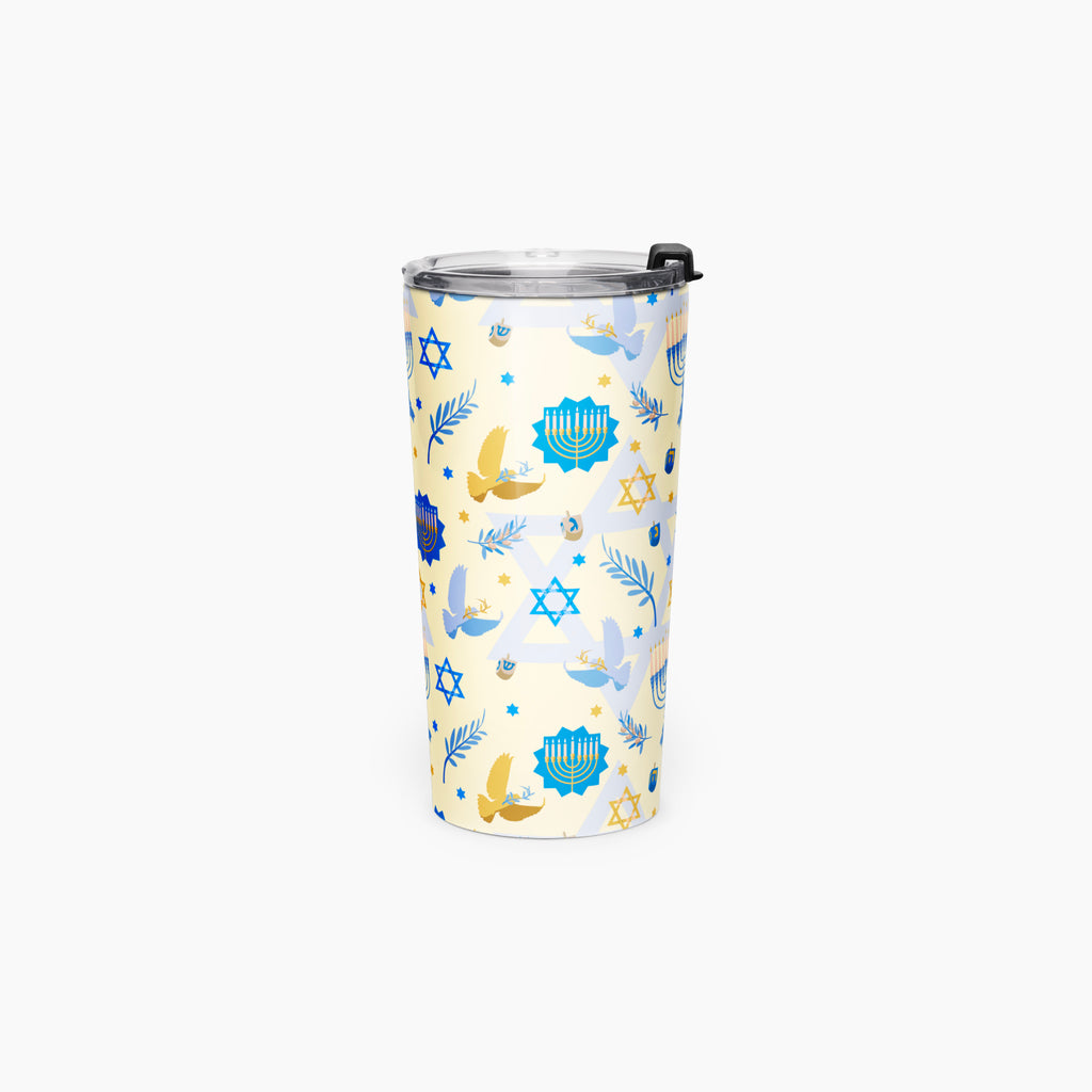 A tall insulated tumbler with a clear lid and black flip-straw detail, decorated with a festive pattern of blue and gold menorahs, Star of David stars, and doves on a pale yellow background.