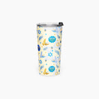 A tall insulated tumbler with a clear lid and black flip-straw detail, decorated with a festive pattern of blue and gold menorahs, Star of David stars, and doves on a pale yellow background.