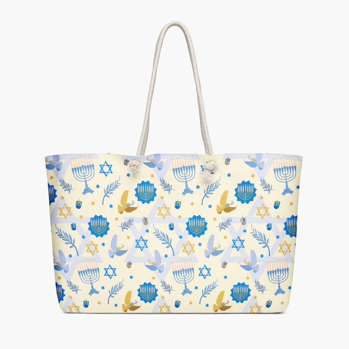 A cream-colored tote bag with a festive Jewish-themed pattern featuring blue menorahs, Star of David emblems, blue and gold doves on a light cream background, complete with two cream rope handles.