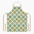 Gardening-themed apron with patterns of boots, hats, and tools on a green and white lattice background.