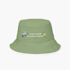 Reversible light green bucket hat with text 'To plant a garden is to believe in tomorrow.' and garden design on a white background