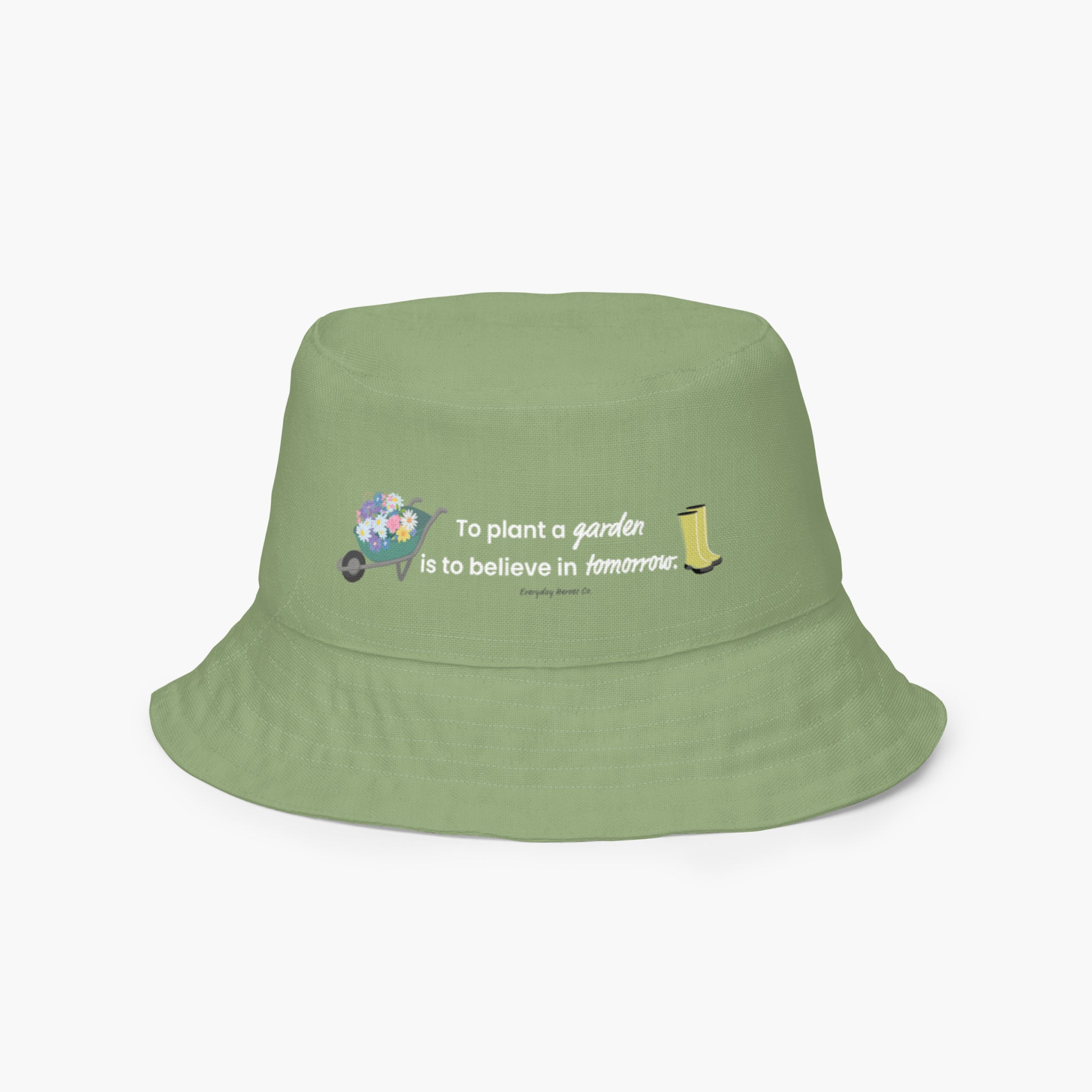 Reversible light green bucket hat with text 'To plant a garden is to believe in tomorrow.' and garden design on a white background