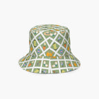Reversible light green bucket hat with custom printed garden lattice fence design on a white background