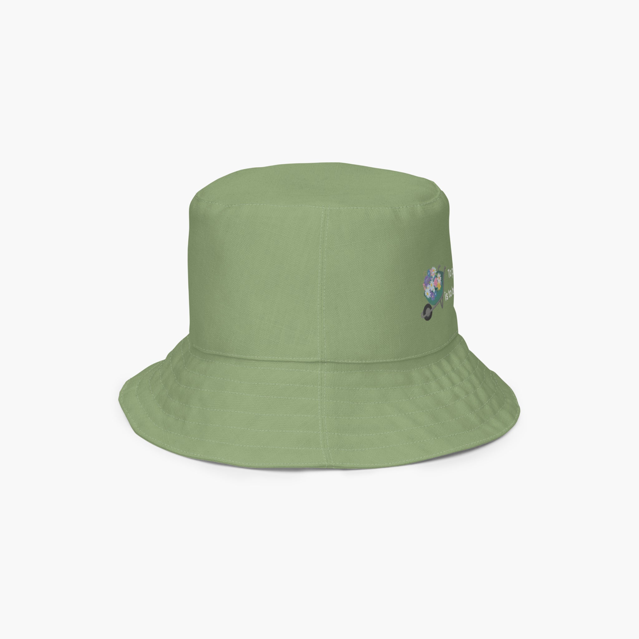 Green bucket hat with a small embroidered design on a white background